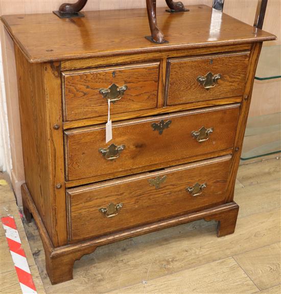 A George III style oak chest of drawers W.84cm